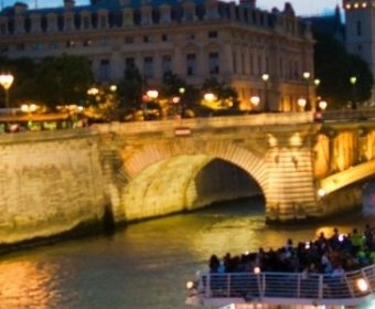 bateau mouche at night along the seine river